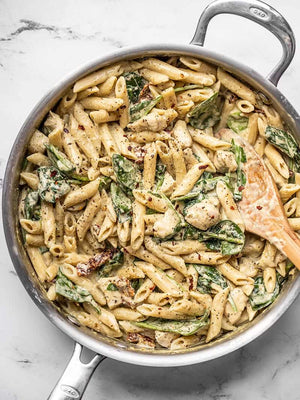 
                  
                    Load image into Gallery viewer, creamy pesto chicken pasta in the skillet
                  
                