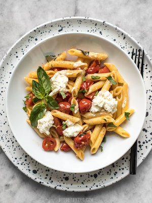 
                  
                    Load image into Gallery viewer, A bowl of Fresh tomato basil pasta with ricotta, garnished with fresh basil
                  
                