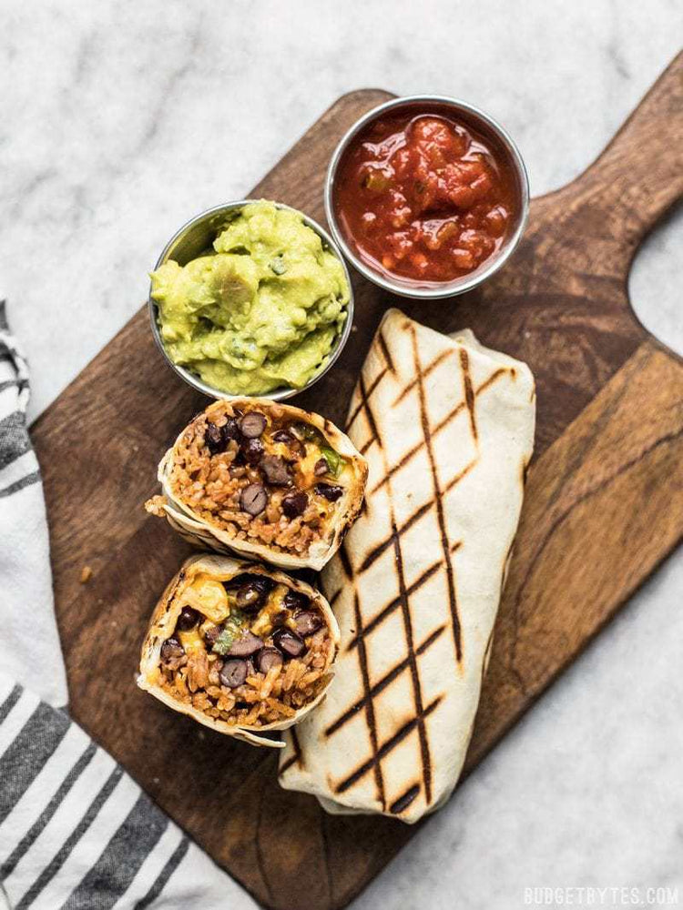 
                  
                    Load image into Gallery viewer, Freezer burritos next to a bowl of salsa and guacamole
                  
                